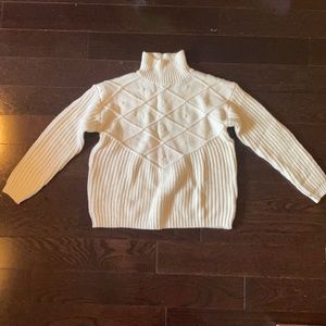 Cream colored turtleneck sweater